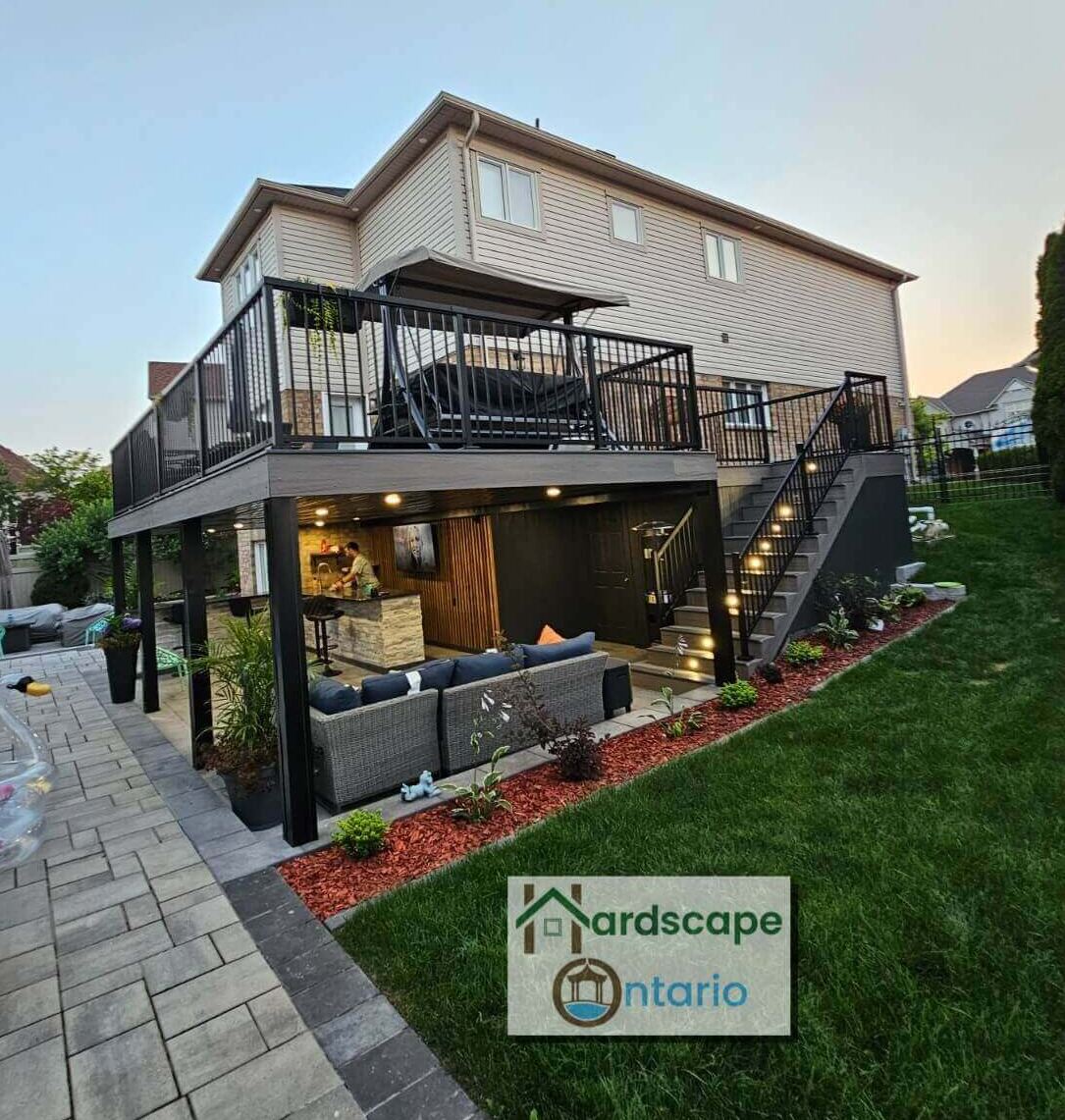 Perfectly designed huge multi-level deck with stairs to go upper level and interlock patio with an amazing seatings and outdoor kitchen