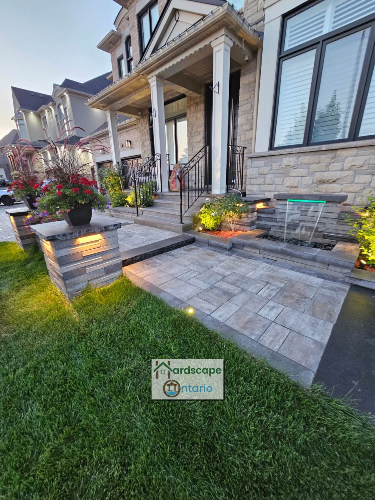 Curb appealing front yard with a water fountain and retaining walls